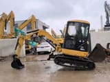 Caterpillar 303CR mini excavator, side profile view
