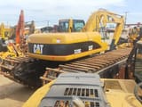 2010 Caterpillar 320C amphibious excavator, rear three-quarter view