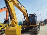 2023 Caterpillar 320D2 excavator, front three-quarter view