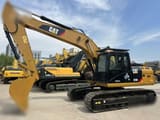 2009 Caterpillar 323DL crawler excavator, side view
