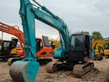 Kobelco SK140-8 crawler excavator, front three-quarter view