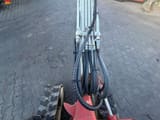 2009 Takeuchi TB014 mini excavator boom and hydraulic lines view