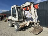 2005 Mecalac 12MXT wheel excavator, front three-quarter view
