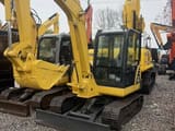 2022 Komatsu PC56-7 crawler excavator, front three-quarter view