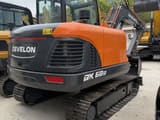 2026 Develon DX60D-10 crawler excavator, rear three-quarter view