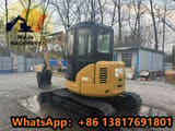 2023 Caterpillar 305CCR mini excavator, rear three-quarter view