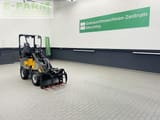 2023 Giant G1200 HD Mini Excavator with a gray body and a grapple bucket attachment featuring red tines.