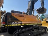 2023 Hyundai 305LC-9T crawler excavator, rear three-quarter view