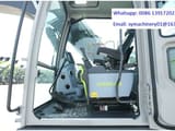 2026 Zoomlion ZE215G Crawler Excavator showing the spacious cab interior from a wider angle.