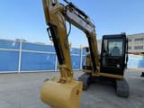 2024 Caterpillar 306E2 mini excavator, front three-quarter view