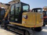 Caterpillar 308E2 mini excavator, rear three-quarter view
