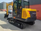 2026 LiuGong 906FG4 Mini Excavator with yellow body and black tracks, showing the operator's cab and a visible '906F' model marking.