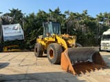 1995 Caterpillar 938F wheel loader, front three-quarter view
