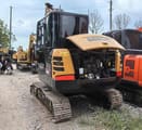 Sany SY60C mini excavator, rear three-quarter view with engine cover open