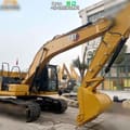 2022 Caterpillar 320GC crawler excavator side view