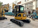 2022 Caterpillar 303.5 C CR mini excavator, rear three-quarter view