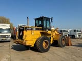1995 Caterpillar 938F wheel loader, rear three-quarter view