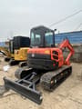 2022 Kubota U55-4 mini excavator, rear three-quarter view