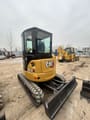 2019 Caterpillar 303.5E mini excavator, rear three-quarter view