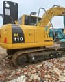 2024 Komatsu PC110 crawler excavator, rear three-quarter view