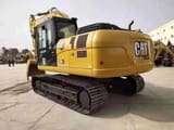 2020 Caterpillar 320GX crawler excavator rear three-quarter view