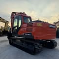 2020 Doosan DX140LC-5C crawler excavator, rear three-quarter view