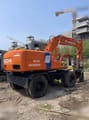 1993 Hitachi EX100WD wheel excavator, rear three-quarter view