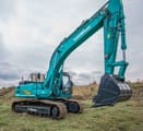 2024 Sunward SWE 335F Mini Excavator with a teal body, showcasing the full length of the boom and arm.