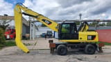 2011 Caterpillar M318D MH material handler, side view