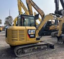 Caterpillar 306E2 mini excavator, rear three-quarter view