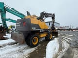 2014 Volvo EW140D wheel excavator rear three-quarter view