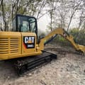 2022 Caterpillar 306E2 mini excavator, rear three-quarter view