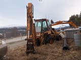 1988 CASE 680K backhoe loader, rear view