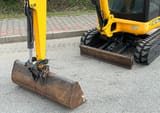 2012 JCB 8018 CTS mini excavator front view with bucket and blade