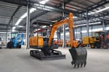 2025 Müller Machinery MB 30-VSH Mini Excavator with its orange boom extended and black bucket with teeth