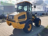 2015 JCB 409 wheel loader, rear three-quarter view