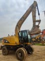 2023 Caterpillar M315D wheel excavator, side profile view