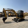 2023 Caterpillar 305.5E mini excavator, side profile view