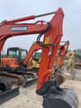 2023 Doosan DX60-9C mini excavator, front three-quarter view