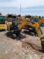 2024 Komatsu PC18 mini excavator, rear three-quarter view