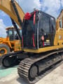 2023 Caterpillar 320GC crawler excavator, front three-quarter view