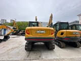 2026 XCMG XE75GA Mini Excavator viewed from the rear, highlighting the counterweight and rear lights.