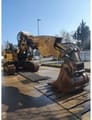 2013 Caterpillar 328D Tunnelbag crawler excavator, side view