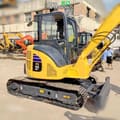 Komatsu PC55MR-2 mini excavator, side view