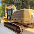 2022 Caterpillar 333 crawler excavator, rear three-quarter view