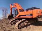 2022 Doosan DH500LC-7 excavator, rear three-quarter view