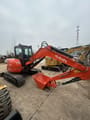 2024 Kubota U55-4 mini excavator, side profile view