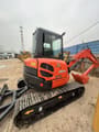 2024 Kubota U55-4 mini excavator, rear three-quarter view