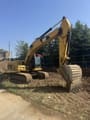 2012 Caterpillar 323DL crawler excavator, side view