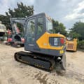 2024 Volvo EC55D mini excavator, rear three-quarter view